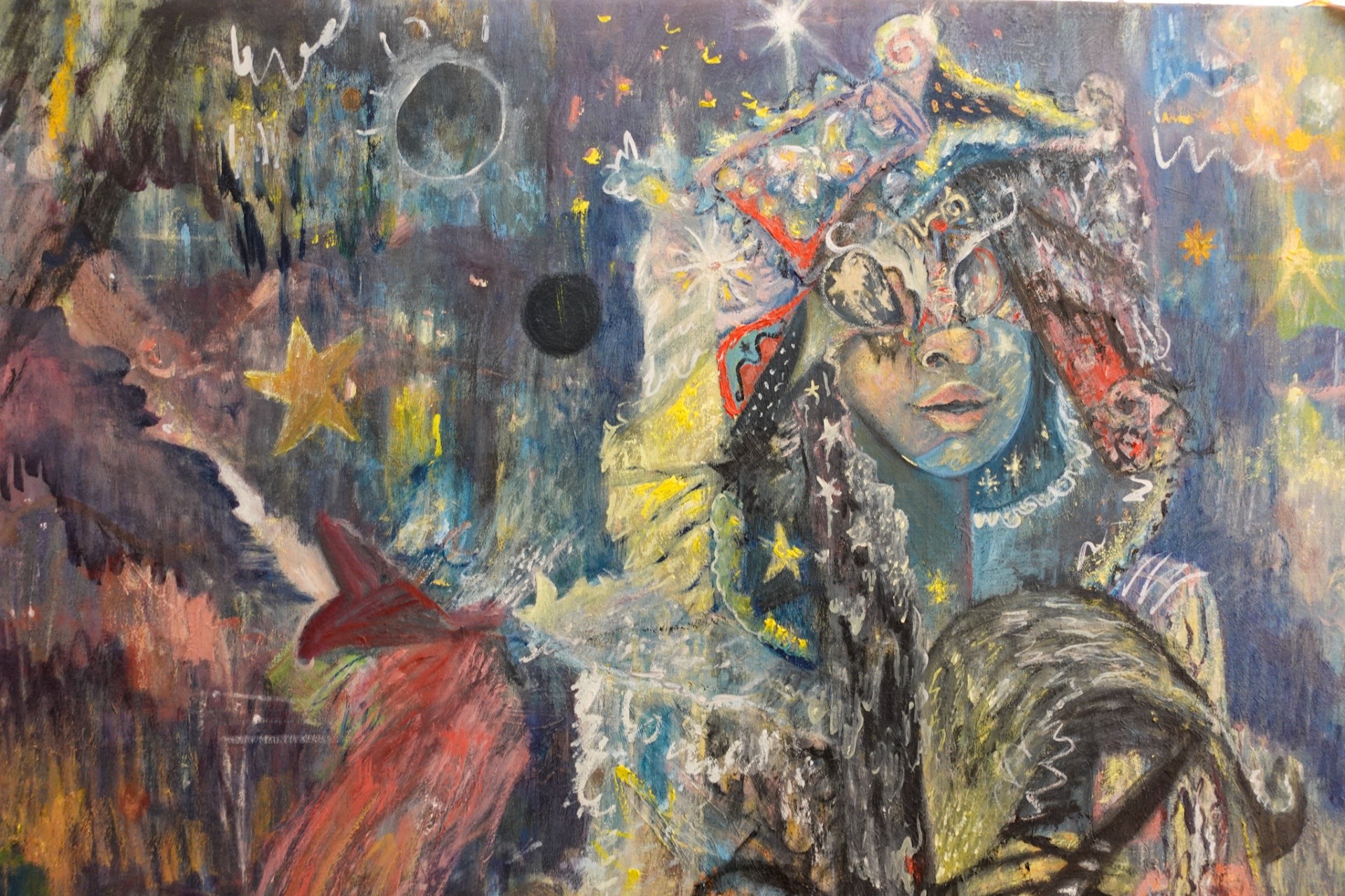 ZANCHES in the studio, seated in front of a large mixed-media painting